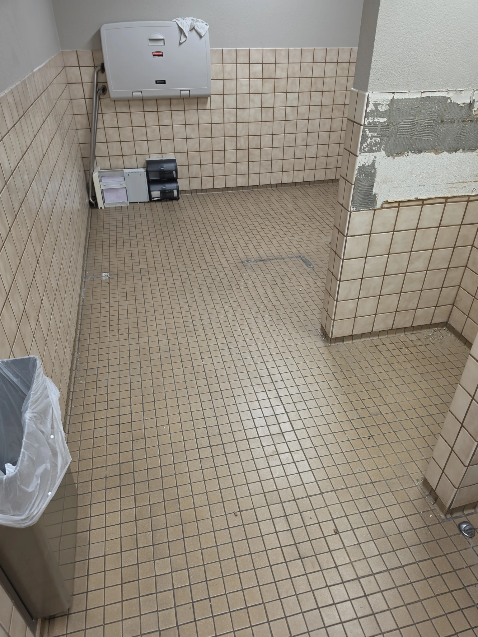 Original construction debris clearing result with unfinished wall surfaces